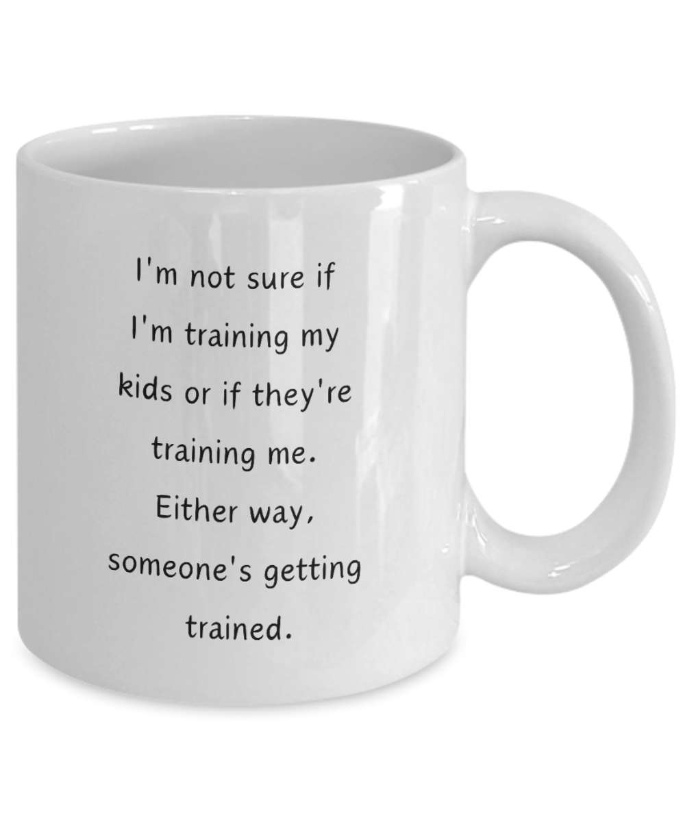Funny Parent Mom Dad Ceramic White Mug Training Kids or Kids Training Us