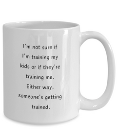 Funny Parent Mom Dad Ceramic White Mug Training Kids or Kids Training Us