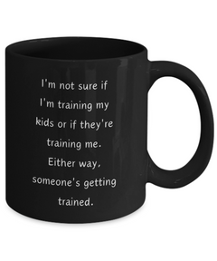 Funny Parent Mom Dad Ceramic Black Mug Training Kids or Kids Training Us