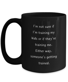 Funny Parent Mom Dad Ceramic Black Mug Training Kids or Kids Training Us