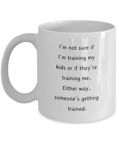 Funny Parent Mom Dad Ceramic White Mug Training Kids or Kids Training Us