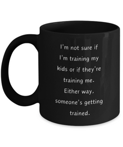 Funny Parent Mom Dad Ceramic Black Mug Training Kids or Kids Training Us