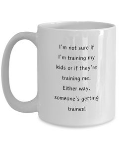 Funny Parent Mom Dad Ceramic White Mug Training Kids or Kids Training Us