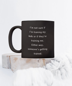 Funny Parent Mom Dad Ceramic Black Mug Training Kids or Kids Training Us